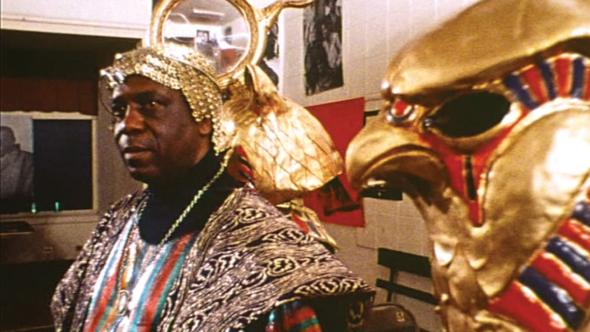 Film still from John Coney’s 1974 film Space is the Place, depicting Sun Ra in costume.