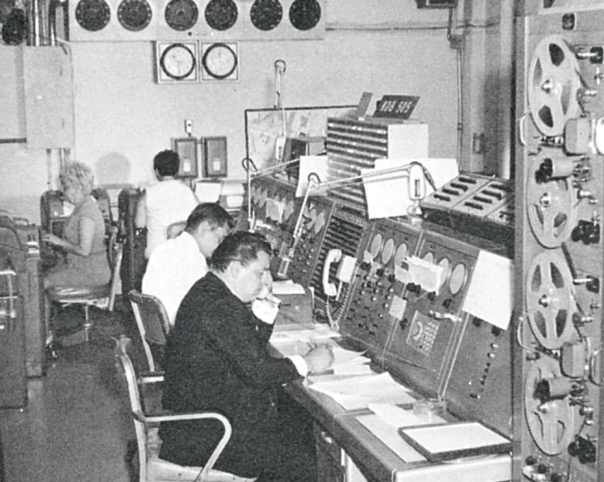 A 1966 photograph of workers at an analog traffic control center in New York City.