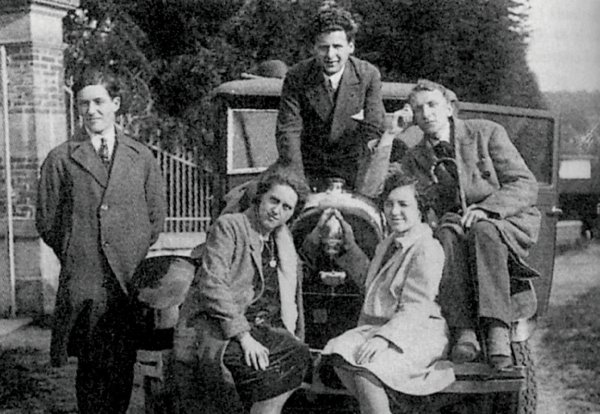 A photograph of Maurice Blanchot, Emmanuel Lévinas, and three other friends, ca. nineteen twenty five, gathered around a car on their way to dine at the home of Charles Blondel, professor of psychology at the University of Strasbourg, where Blanchot and Lévinas were enrolled. 