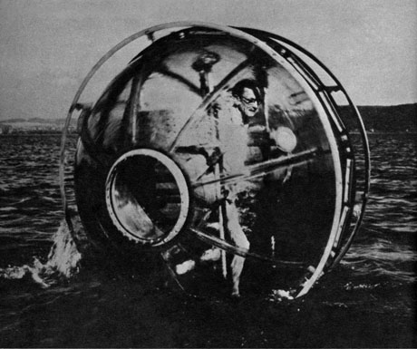 A photograph of Wayne Wilson on the water in his squirrel cage.