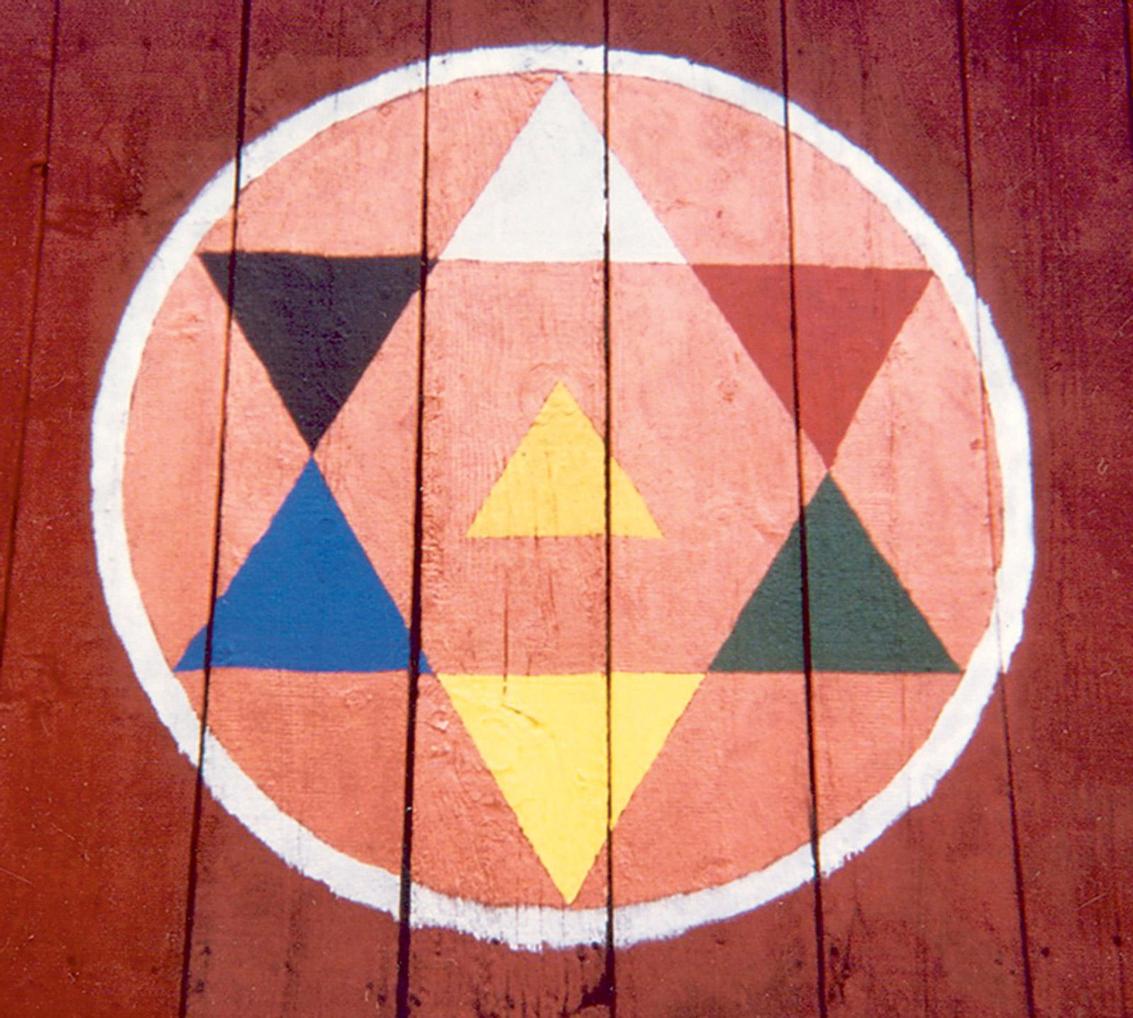 A multicolor hex sign painted on a Pennsylvania barn.