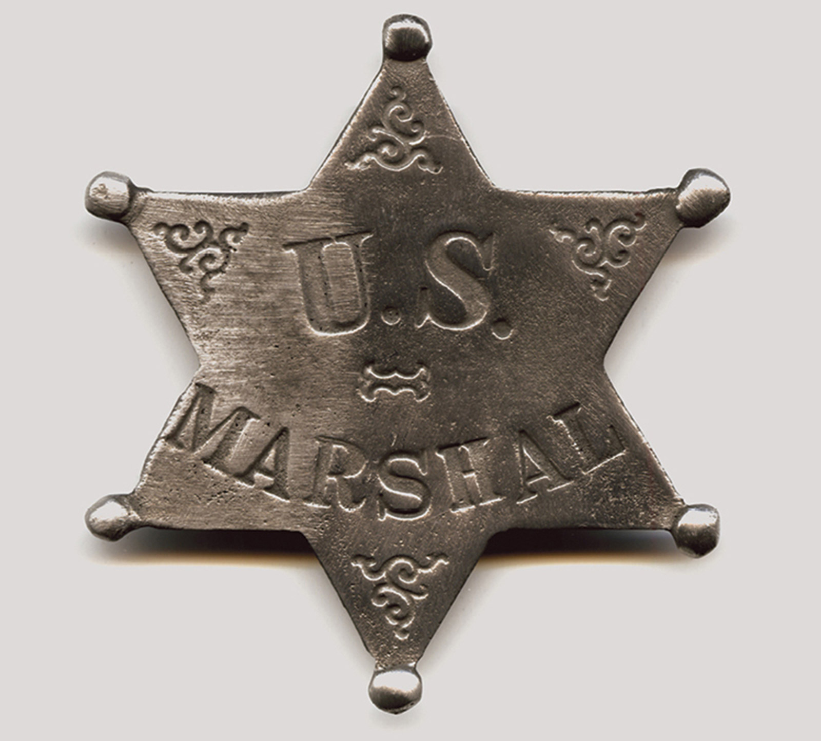 A US Marshal star badge replica in the shape of a hexagram.