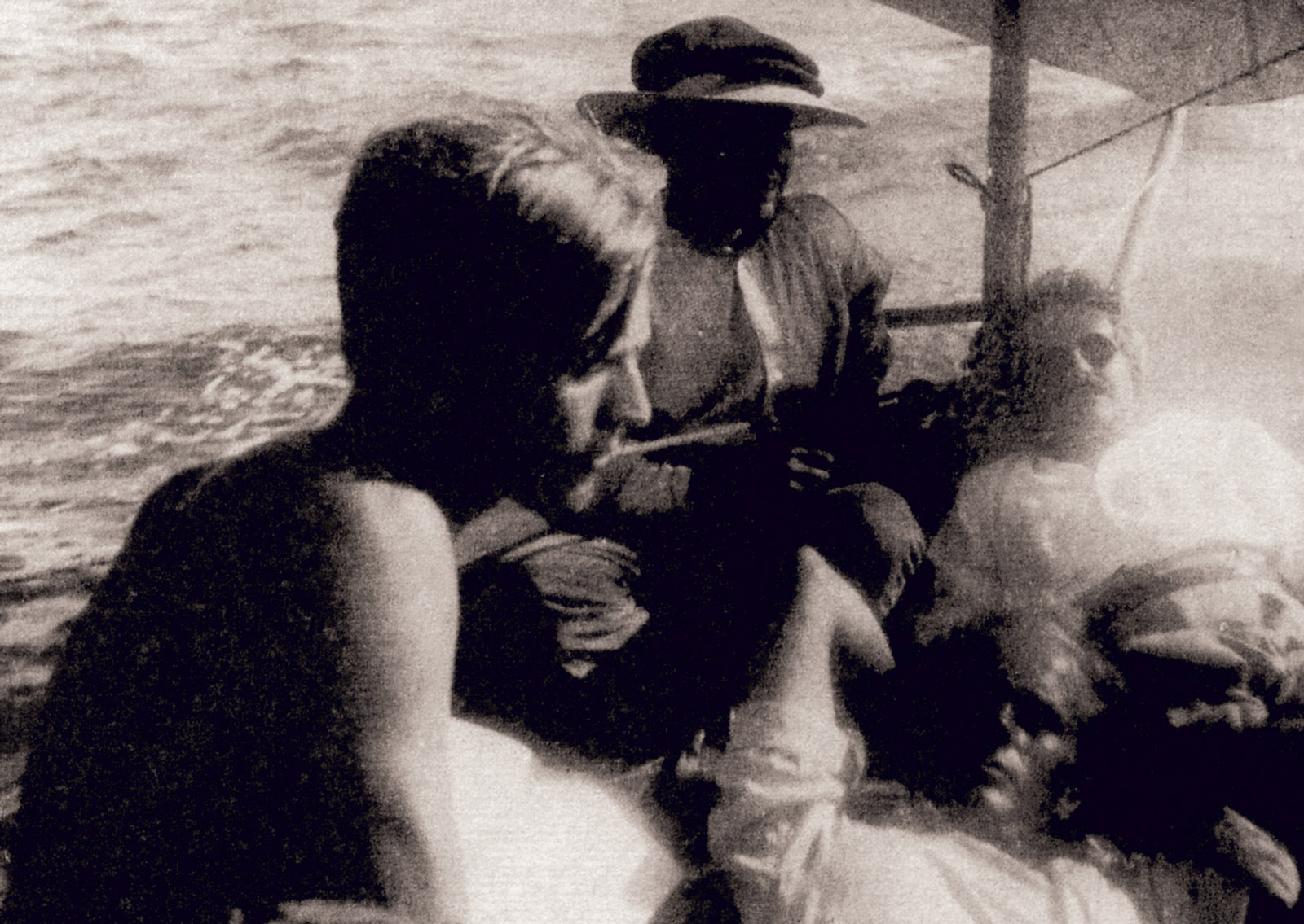 A photograph of Jean Selz, Paul Gauguin (the painter’s grandson), Benjamin, and fisherman Tomás Varó sailing in the bay of San Antonio, May nineteen thirty-three.