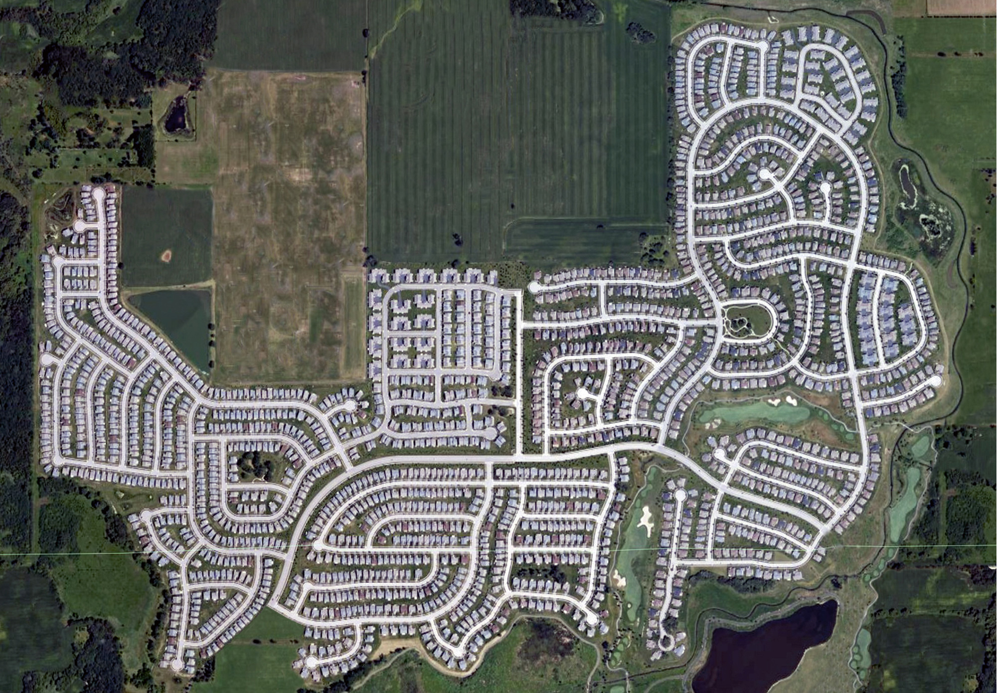 An altered aerial photograph by Jeremy Drummond of a planned housing community in Illinois.