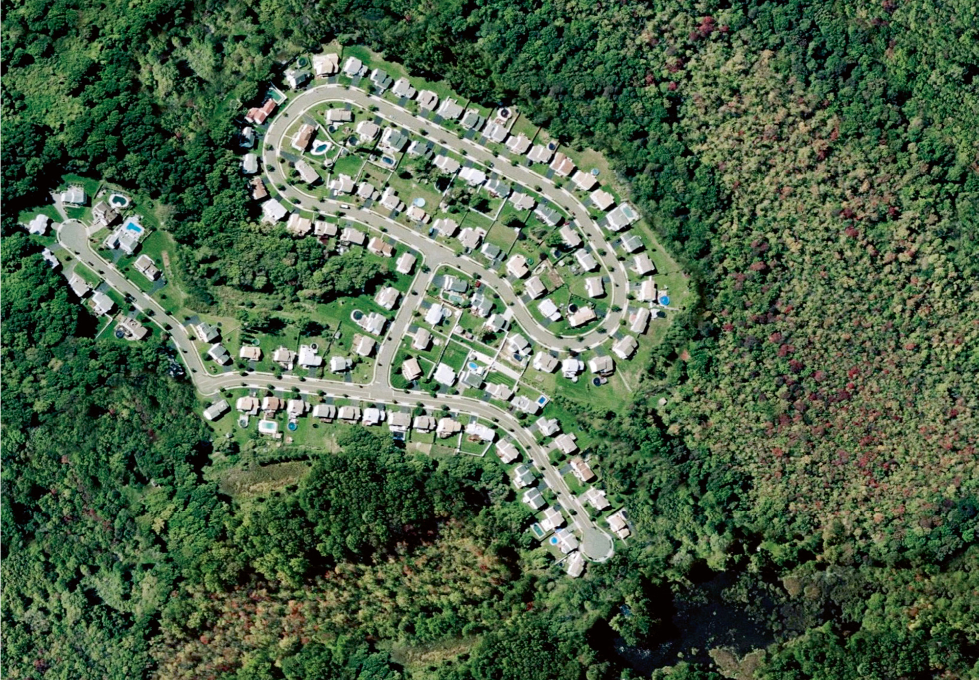 An altered aerial photograph by Jeremy Drummond of a planned housing community in Connecticut.