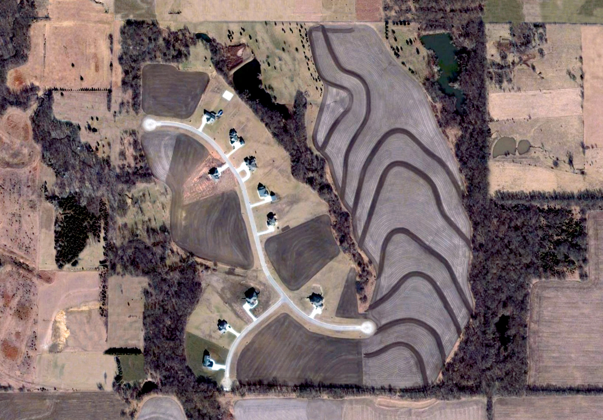 An altered aerial photograph by Jeremy Drummond of a planned housing community in Kansas.