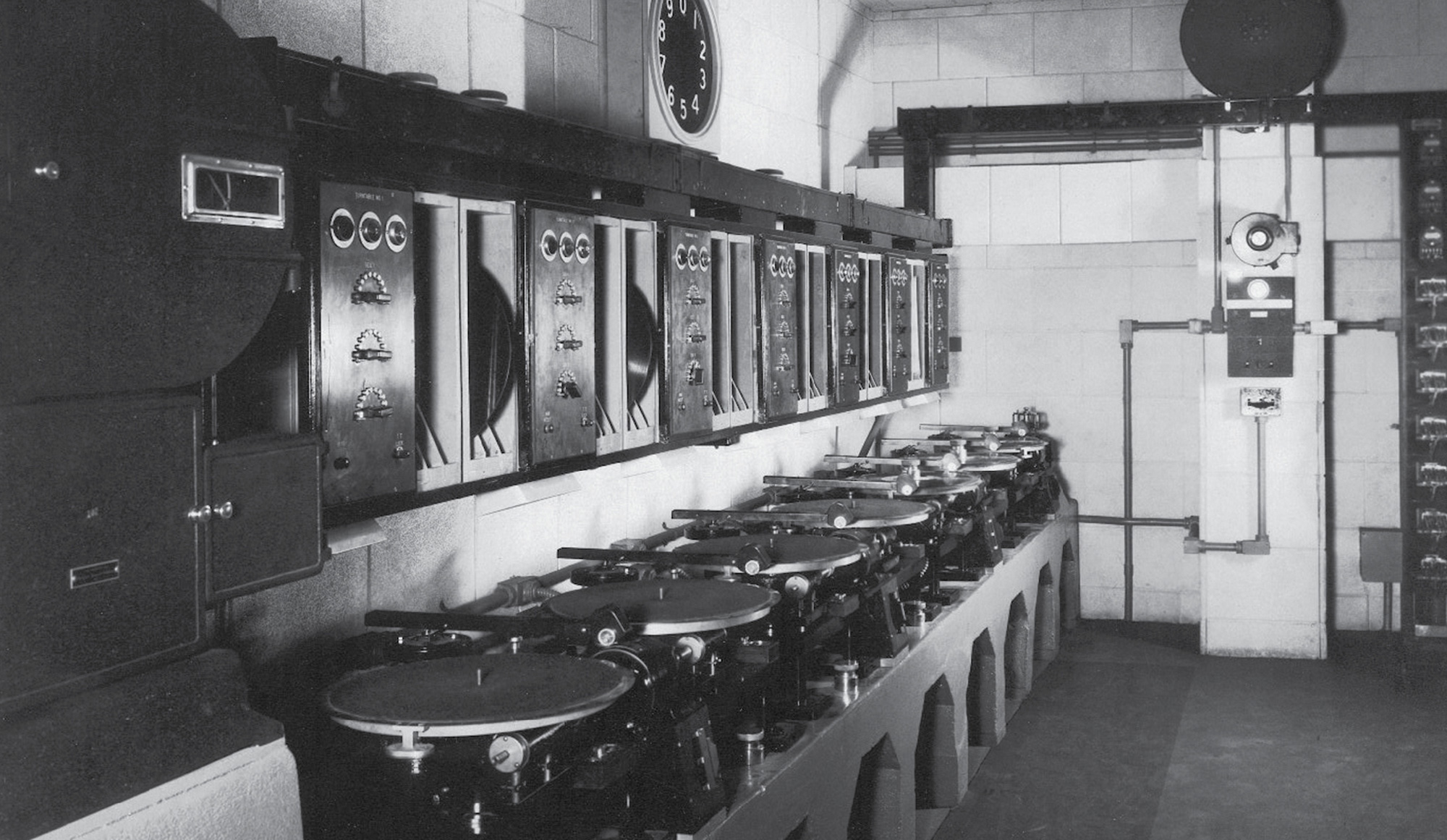 A circa nineteen thirty photograph of Vitaphone disk dubbing systems at Warner Brothers’ Brooklyn studios. The photograph was taken by J. Porter Evans, the chief sound engineer hired to equip the previously silent Vitagraph studios bought by Warners. The complex in Midwood, Brooklyn, is now a school. 