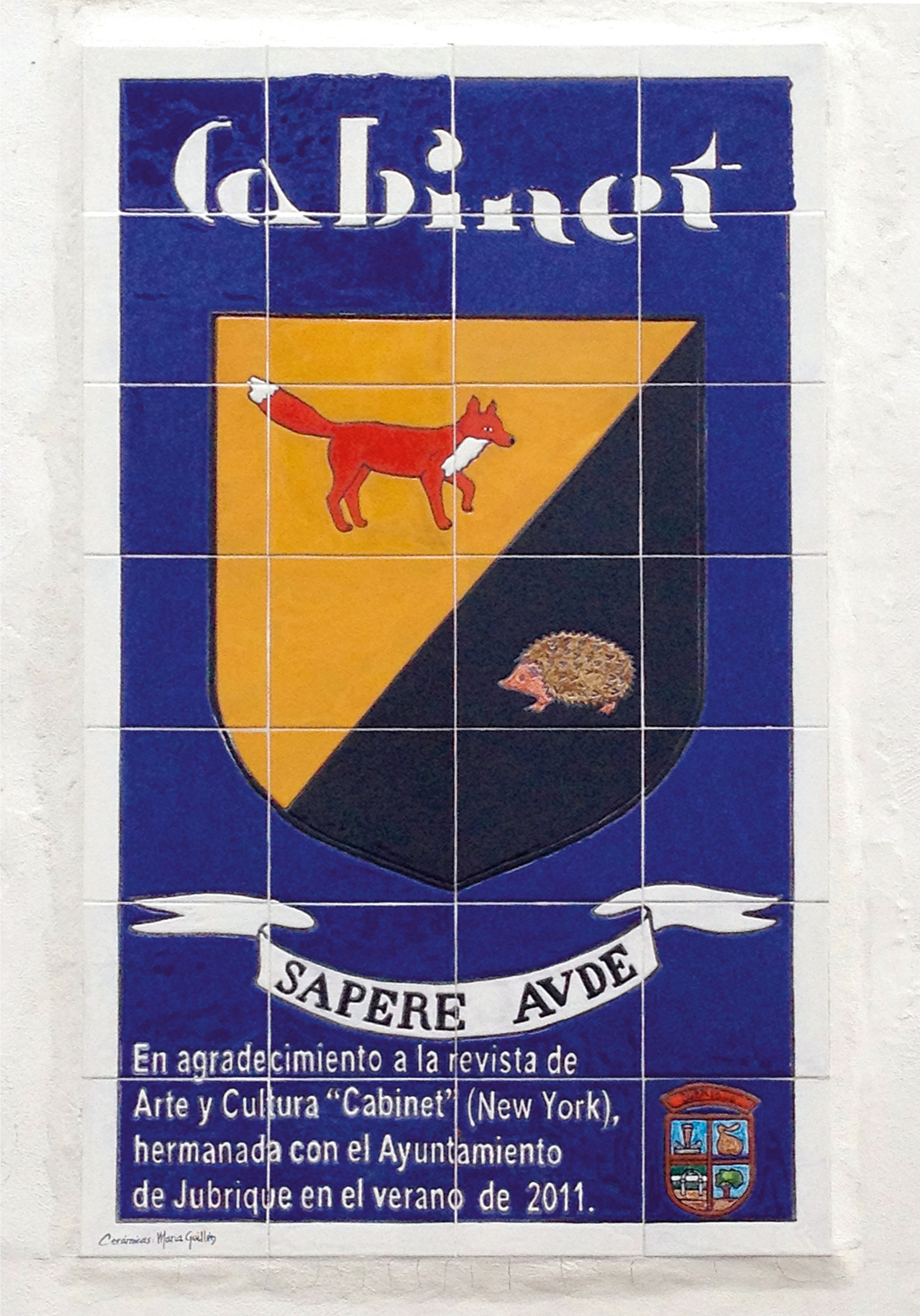 A photograph of Cabinet’s arriviste coat of arms next to Jubrique’s venerable shield. The Spanish text roughly translates as: “In gratitude to the art and culture magazine ‘Cabinet’ (New York), twinned with the municipality of Jubrique in the summer of twenty eleven.”