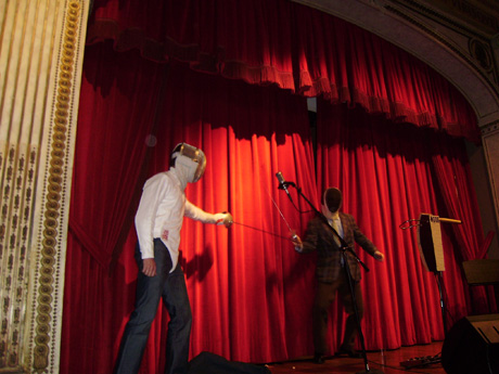 Jonathan Ames, ex-fencer, being challenged to a duel by a masked man claiming to be Russell Wilson, the Columbia fencer who was the subject of the story that Ames had just narrated.