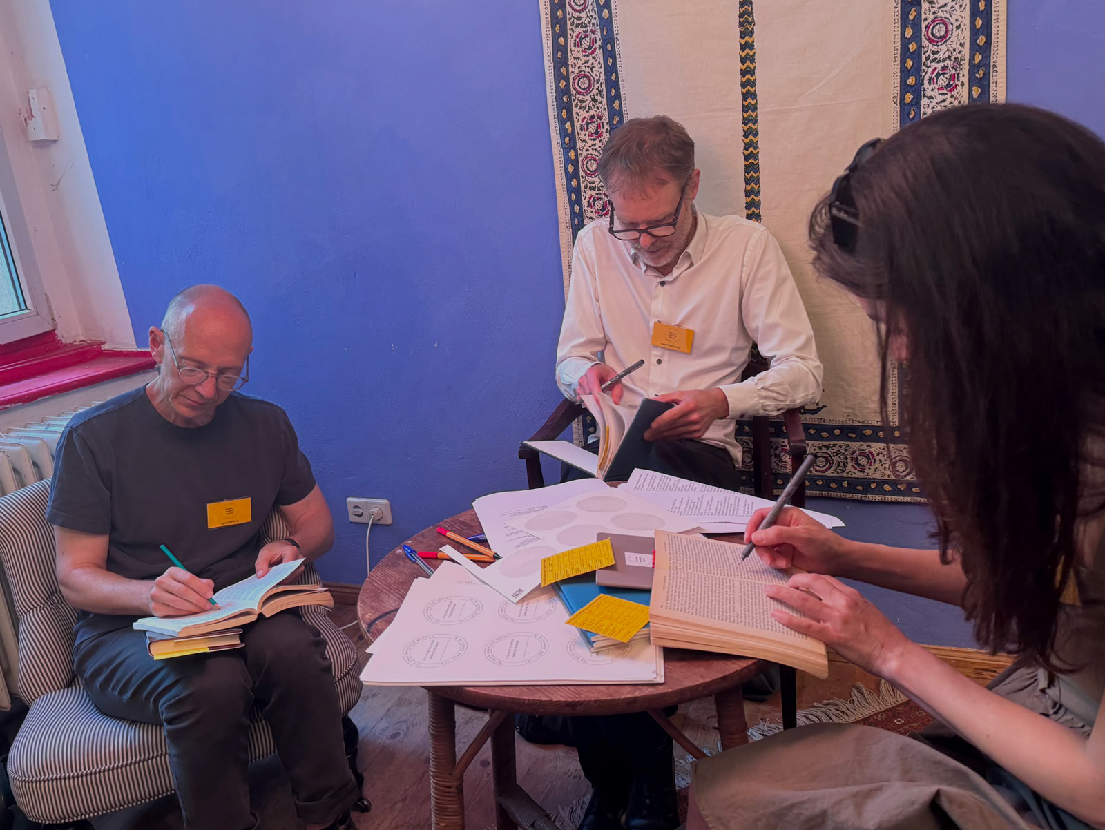 Three Book Handling agents busy at work annotating books brought into the event.