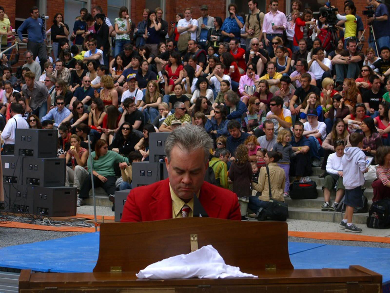 Brian Dewan providing musical accompaniment for the audience before the first duel.