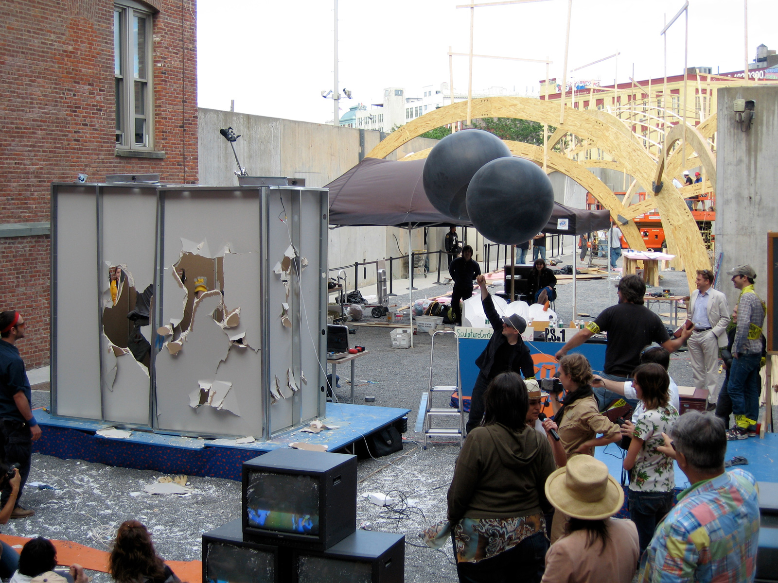 The final artworks: Big Room releases a brick into the atmosphere with the help of the helium balloons, while Type A escape from their room, destroying it in the process.