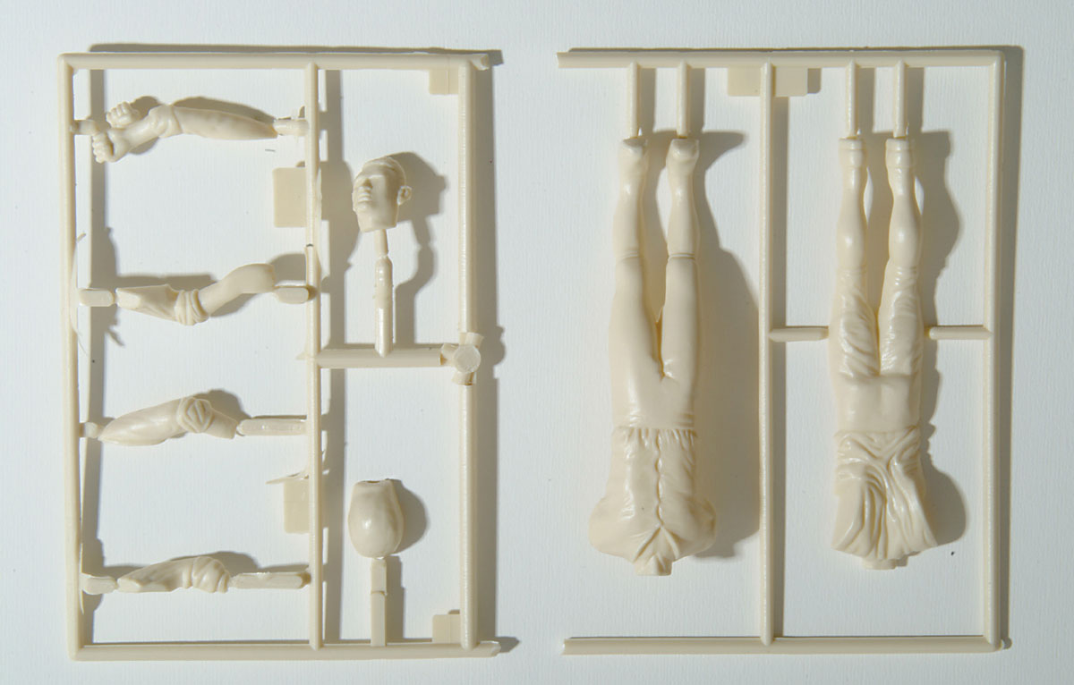 A photograph of “La guillotine” plastic model components from Polar Lights’s reissue of the Aurora model company’s 1960 original.