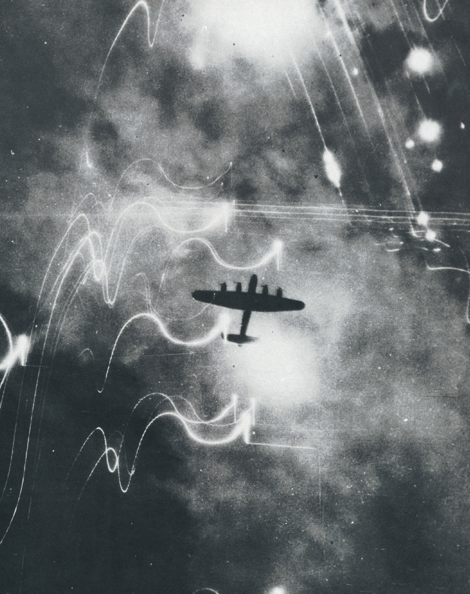 A photograph of a black outline of a Royal Air Force bomber over Hamburg, Germany, 1943.