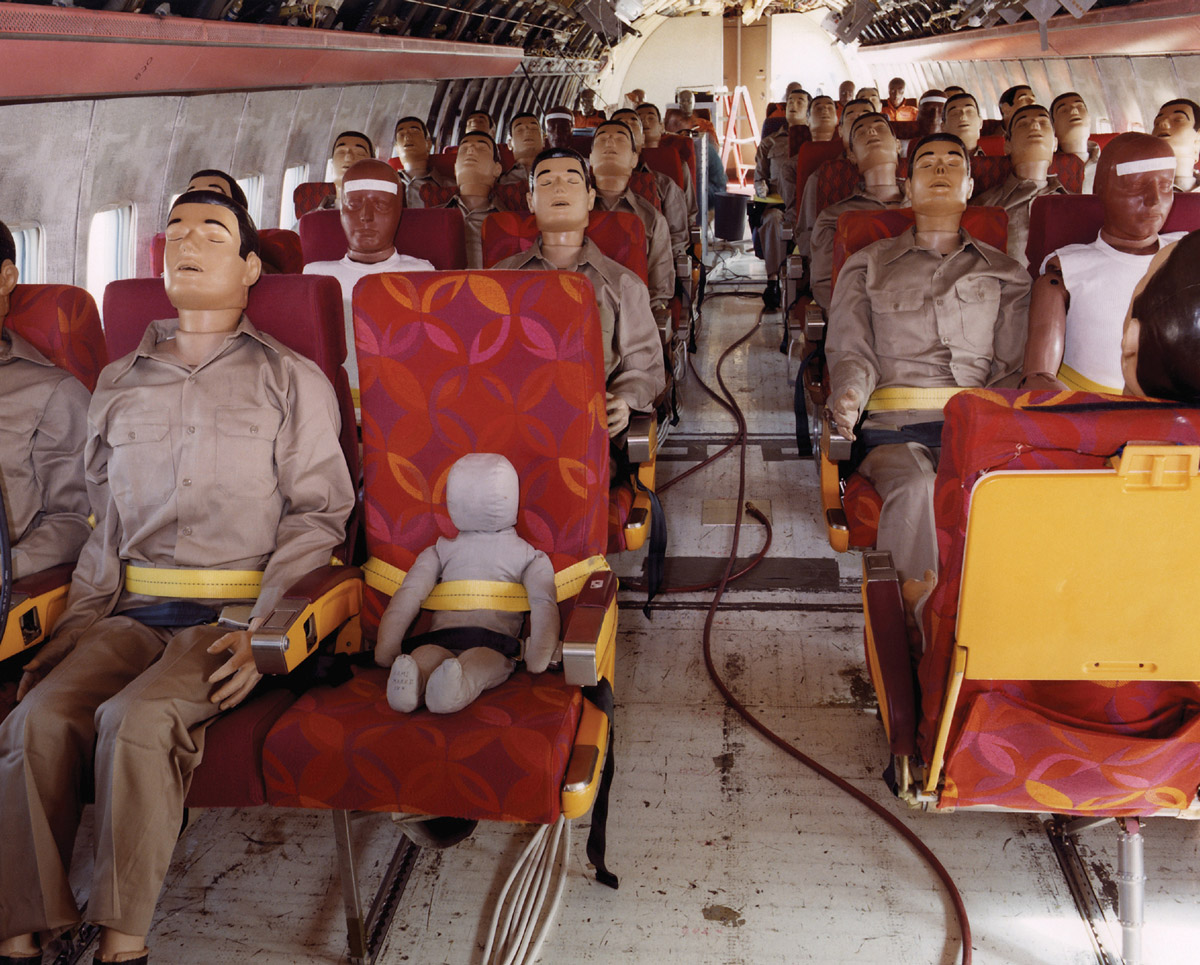 A photograph of crash test dummies seated on a Boeing 720 test flight.