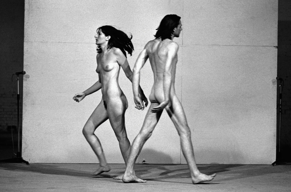 A photograph of Marina Abramović and Ulay walking past each other naked in the 1976 performance entitled Relation in Space.