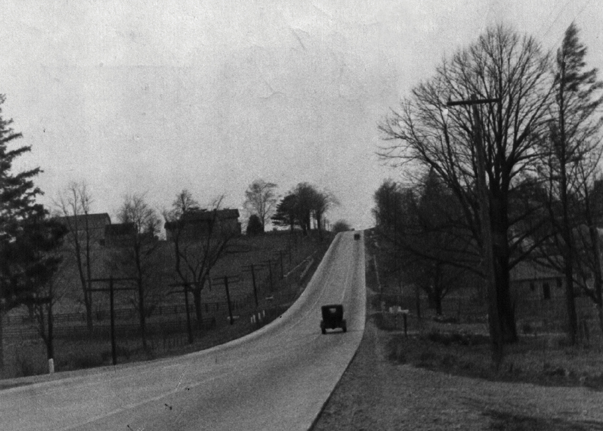1935 black-and-white photograph by Ilya Ilf of a road through the country.