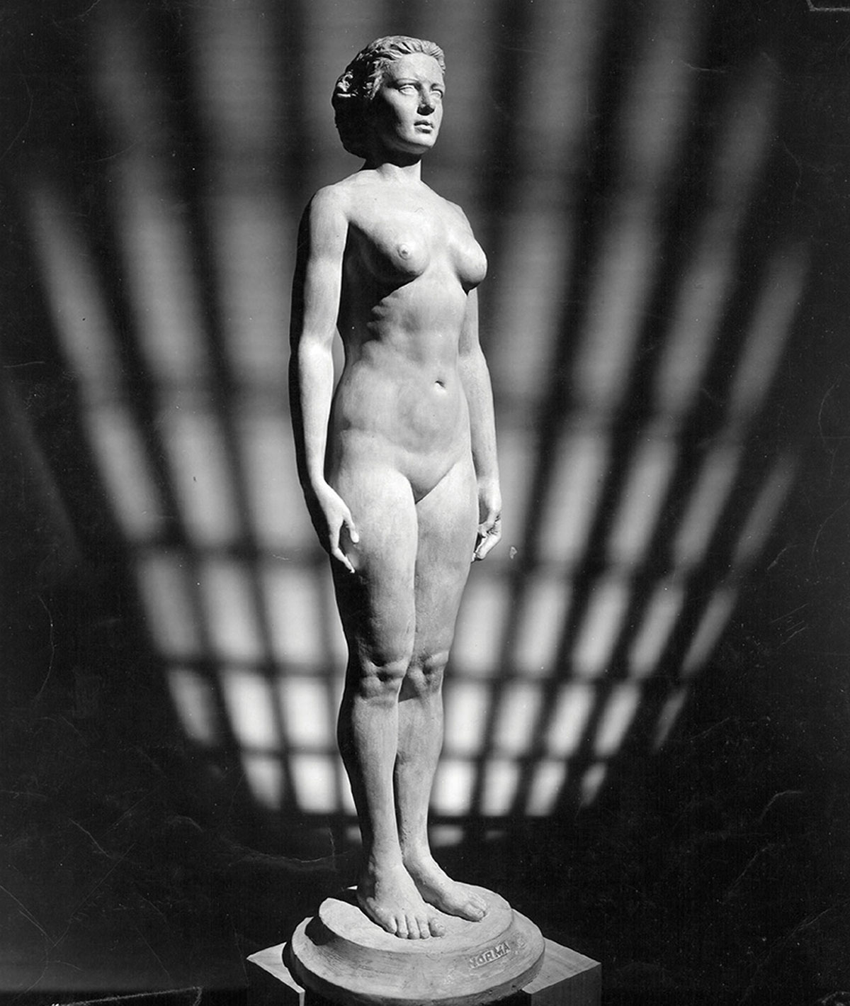 A photograph of a 1943 white alabaster statue entitled “Norma,” based on the measurements of 15,000 women.