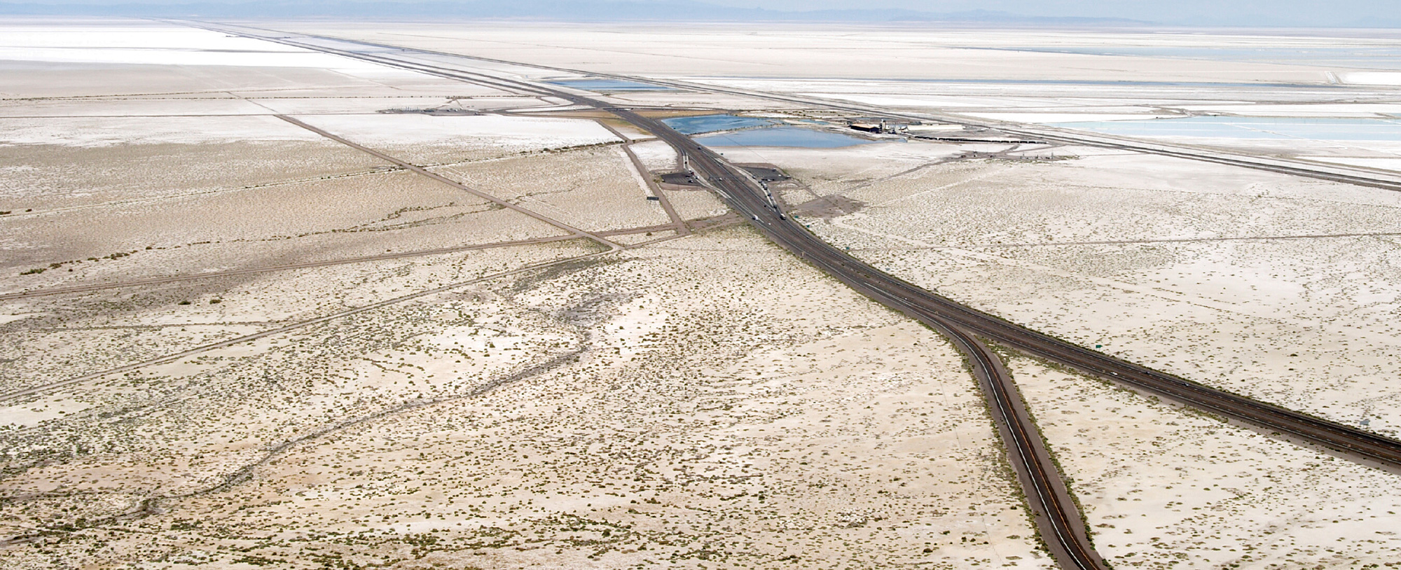 An aerial photograph of roads in a desert landscape.