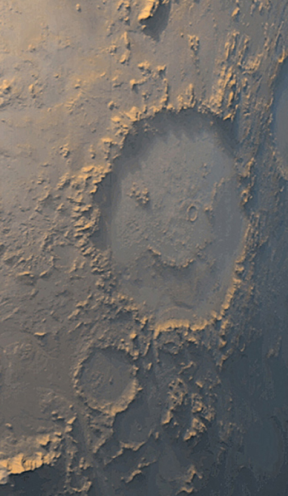 A photograph of Mars’s smiley face–shaped Galle Crater.