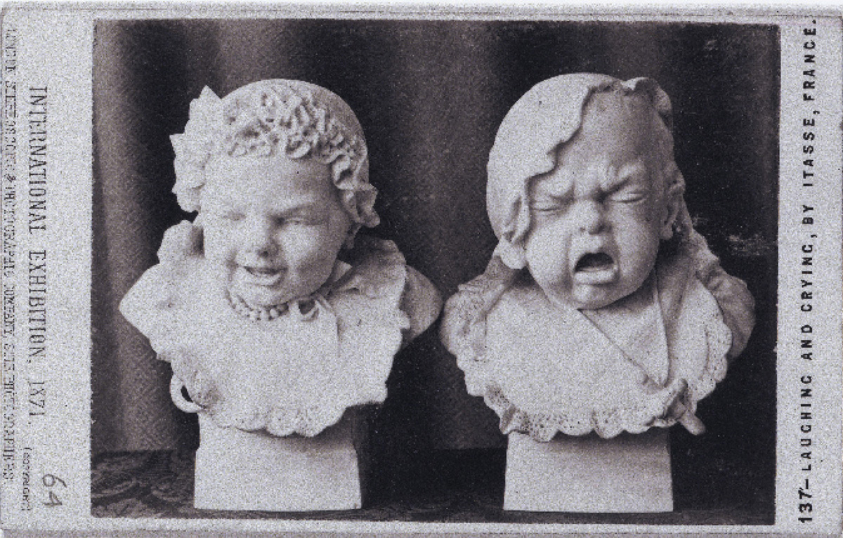 A stereoscopic slide of two sculptures by Adolphe Itasse. The two busts represent laughing and crying infants and would blur together when looked at through the viewfinder. 