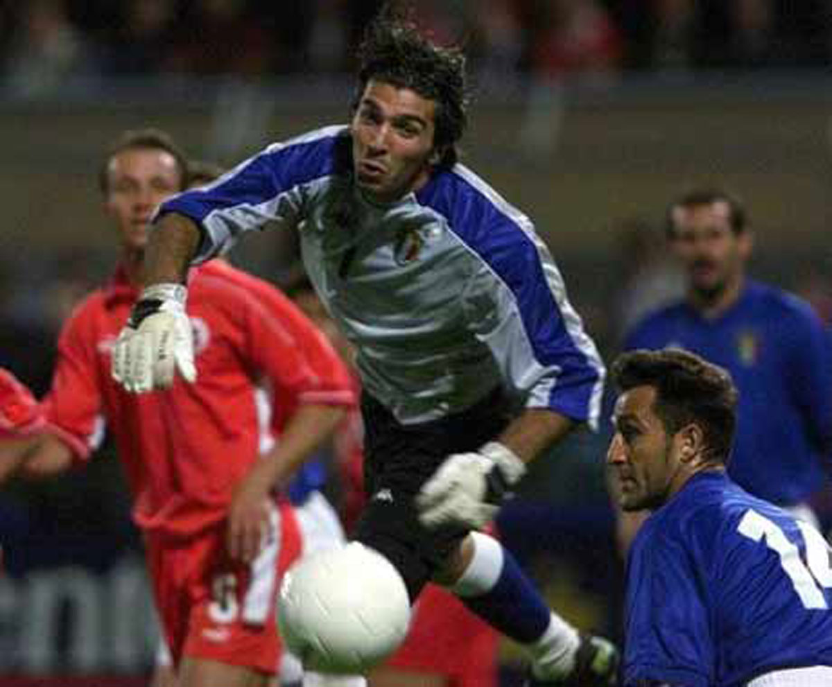 A photograph of Buffon saving a goal.