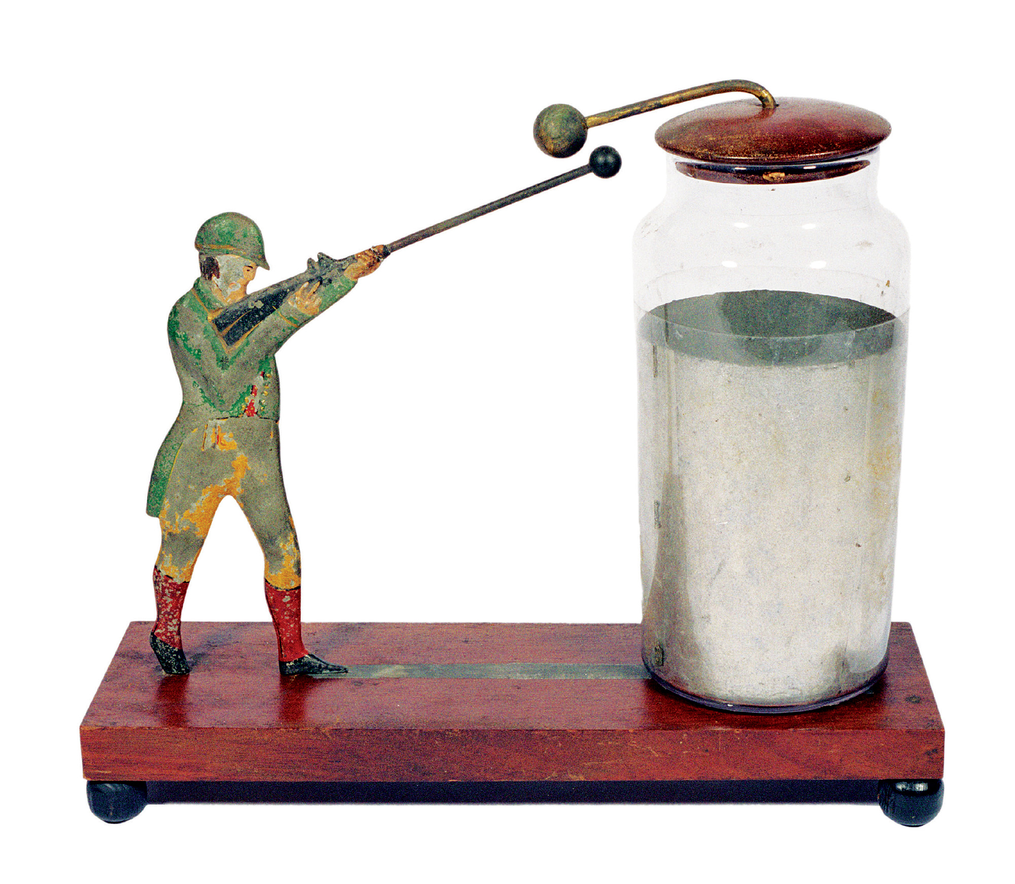 A photograph of the electrical Sportsman, a polychromed, hand-painted model of a hunter resting on a walnut base. This electrostatic demonstration apparatus was sold by many different manufacturers of philosophical instruments, including Benjamin Pike, in the 1840’s. 