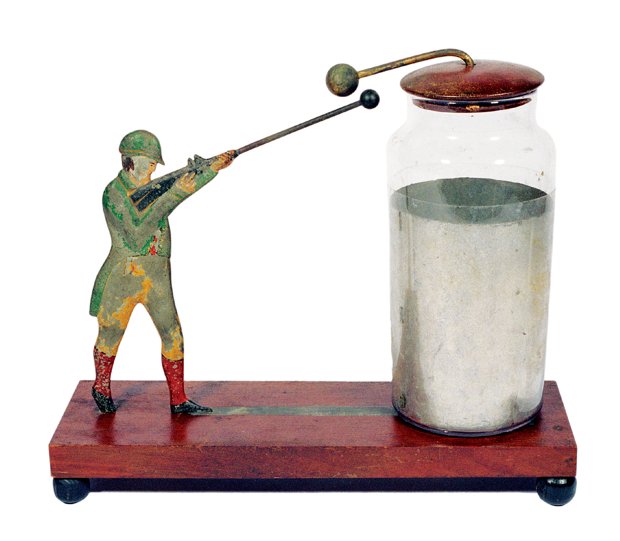 A photograph of the electrical Sportsman, a polychromed, hand-painted model of a hunter resting on a walnut base. This electrostatic demonstration apparatus was sold by many different manufacturers of philosophical instruments, including Benjamin Pike, in the 1840’s.