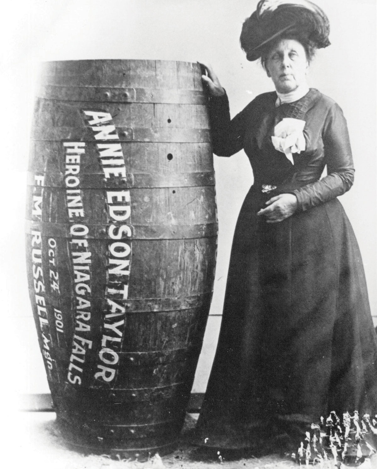 A 1901 photograph of Annie Edson Taylor with a barrel, the first person to successfully make it over Niagara Falls.  