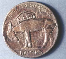 Nickel engraved with a mule standing in front of a shack.