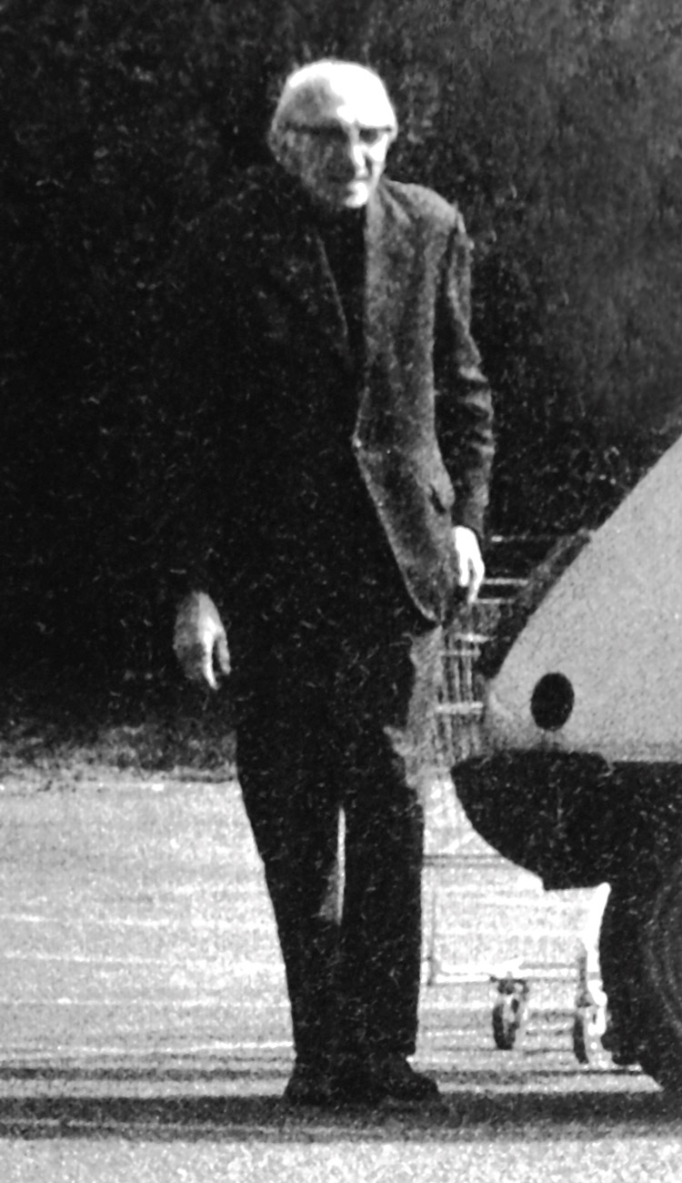 A photograph of Maurice Blanchot in a supermarket parking lot, from the magazine