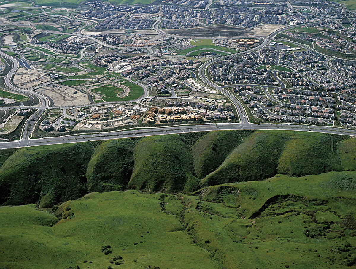 Plastid-implanted hillocks adjacent to housing in Irvine, California.