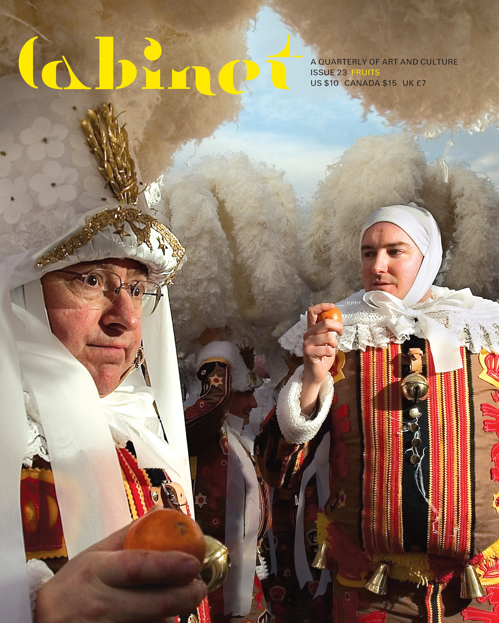 A photograph of a group of men dressed as Gille, the principal character of a carnival in Binche, Belgium. They carry blood oranges to be thrown at onlookers. Legend has it that the “Gille” character was inspired by the sixteenth-century Spanish expeditions to Incan territory, land now contained within the borders of Peru.