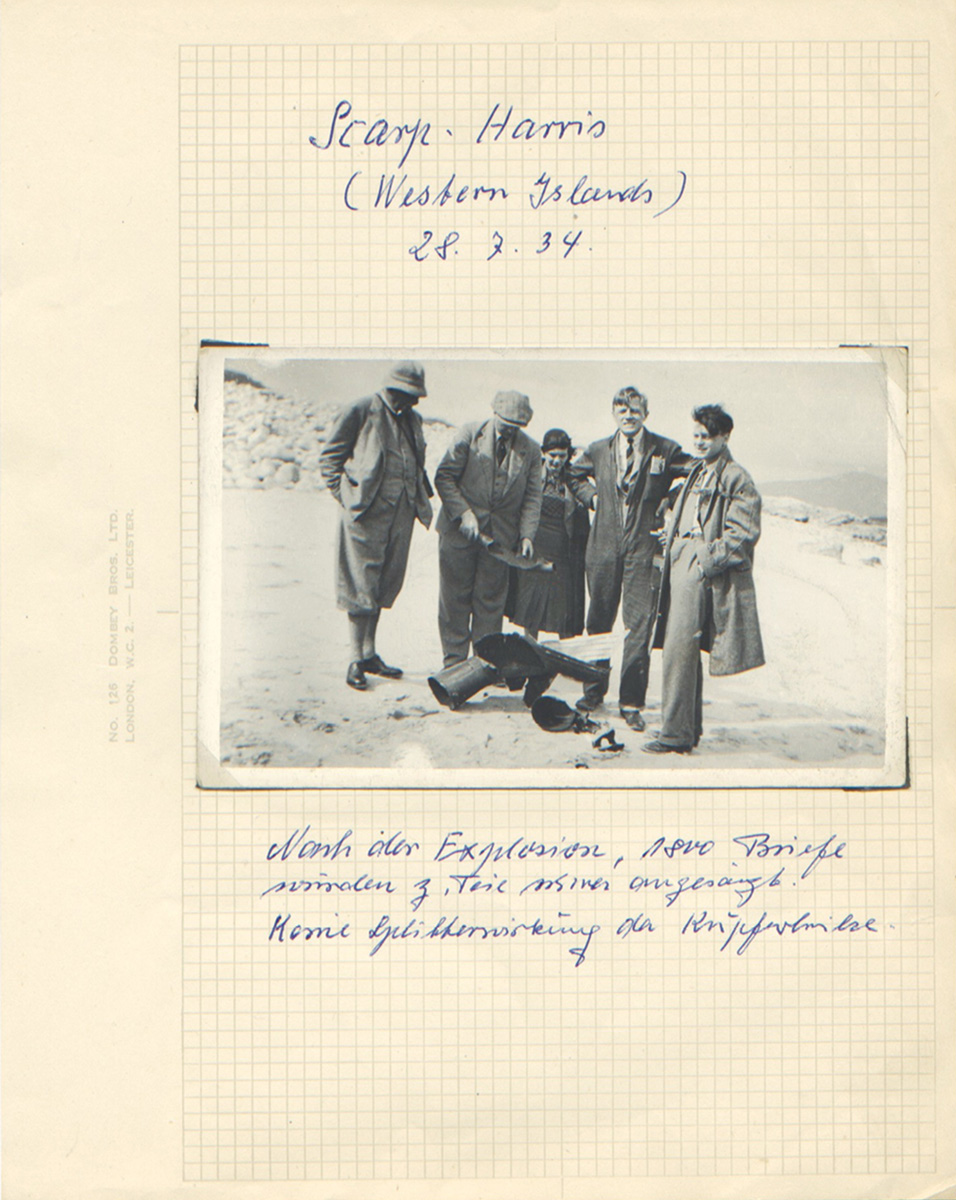 A page from the scrapbook showing a disappointed Zucker grimacing at the camera over the remains of the rocket used in his unsuccessful Scarp-Harris launch in 1934.
