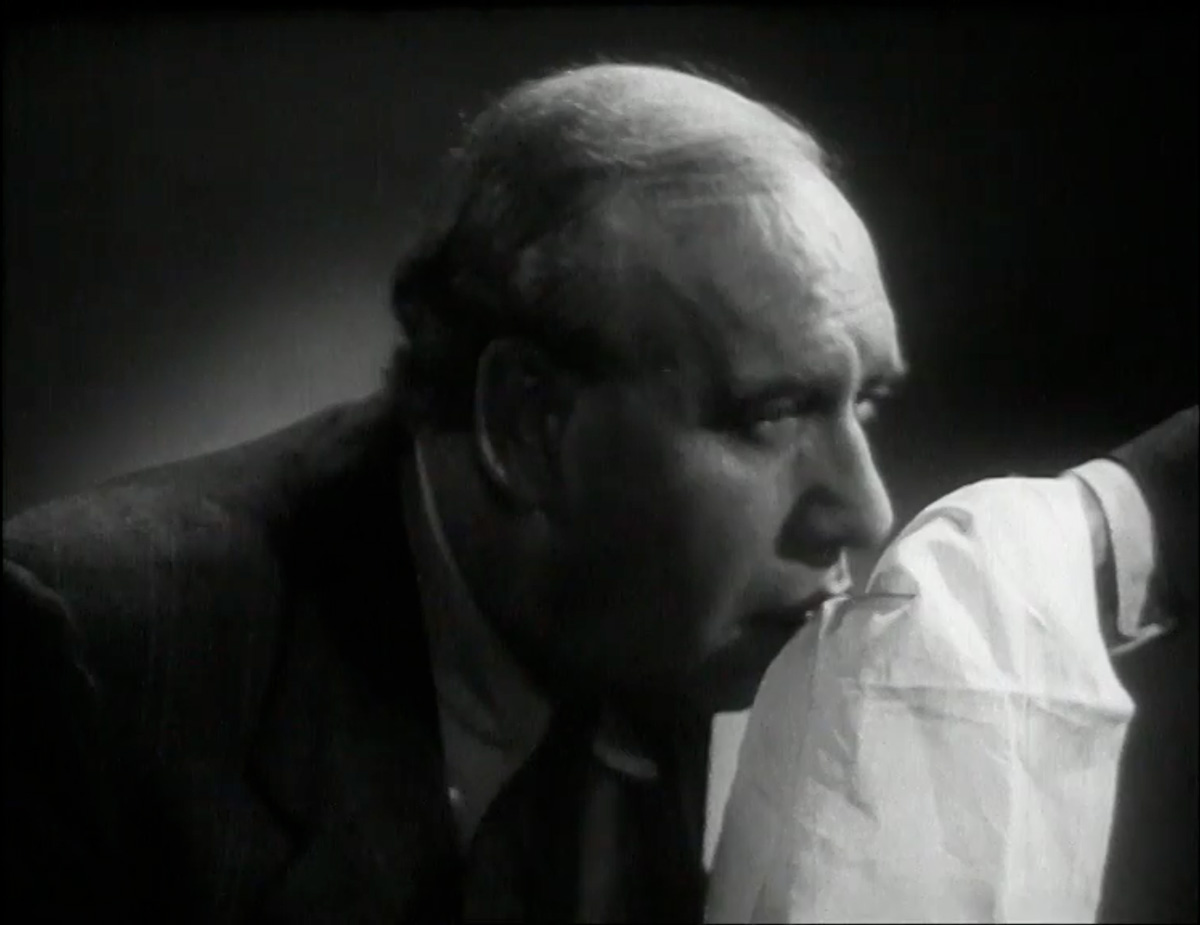 A demonstrator induces a sneezing fit in actor Richard Massingham by showering him in pepper to show the correct use of a handkerchief. This one-minute public information film made by the British COI (Central Office of Information) reminded cinema audiences that “coughs and sneezes spread diseases.” Film still from Handkerchief Drill, 1949, directed by Michael Orrom. Courtesy Crown Copyright / Film Images.