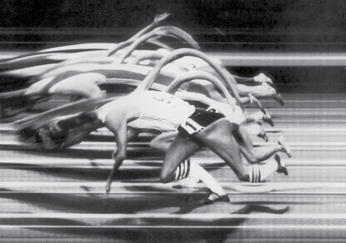 A photograph of runners at a track meet showing the distortions caused by a photo-finish camera.