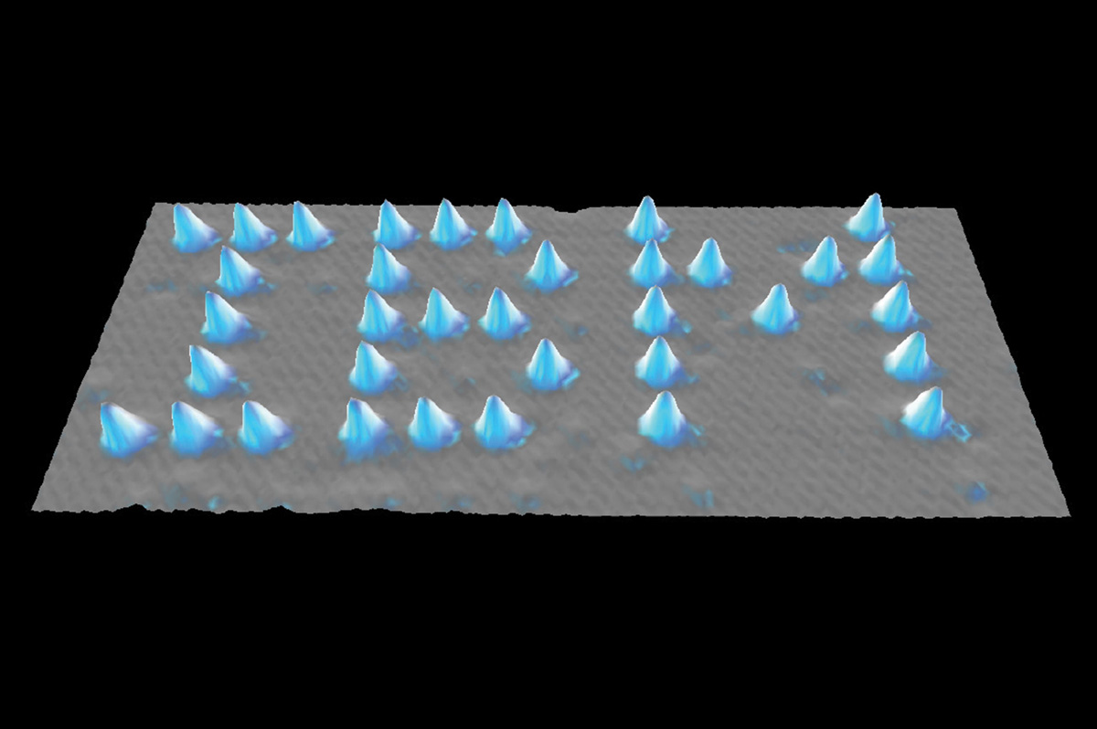 A microphotograph showing Xenon atoms spelling out IBM.