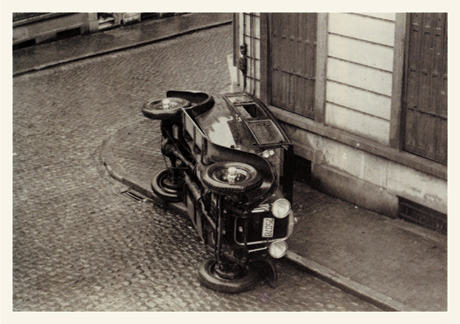 A nineteen twenty nine photograph by artist J. Champroux titled “La Voiture Renversée” from Breton’s collection.