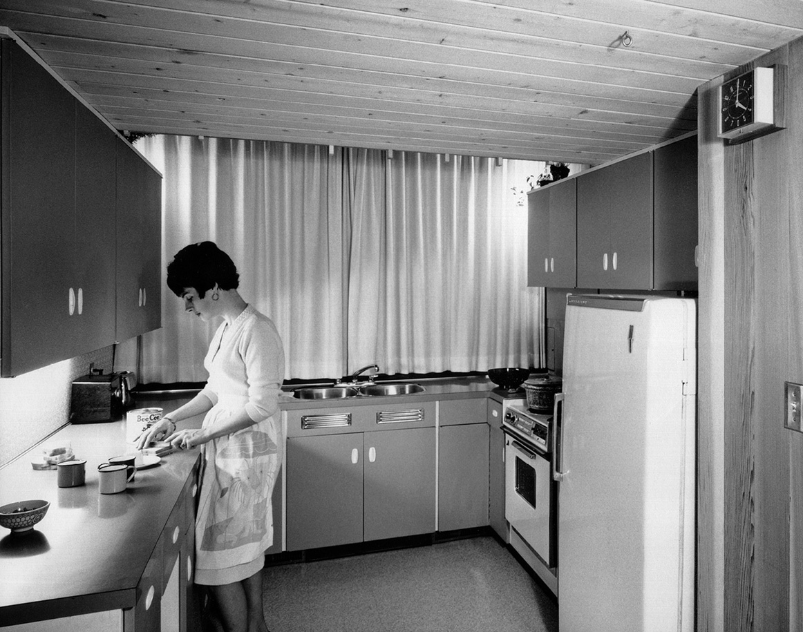 A photograph of Rosalie Gower in the kitchen of the Gower house, nineteen sixty five. Terry Gower, architect.