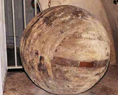 A photograph of a large wooden sphere.