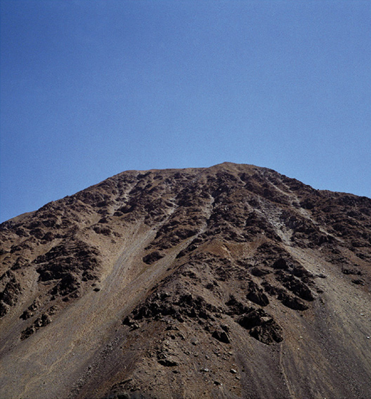 A photograph by artist Marine Hugonnier titled “Mountain with No Name (Pandjshêr Valley, Afghanistan)”, two thousand three.