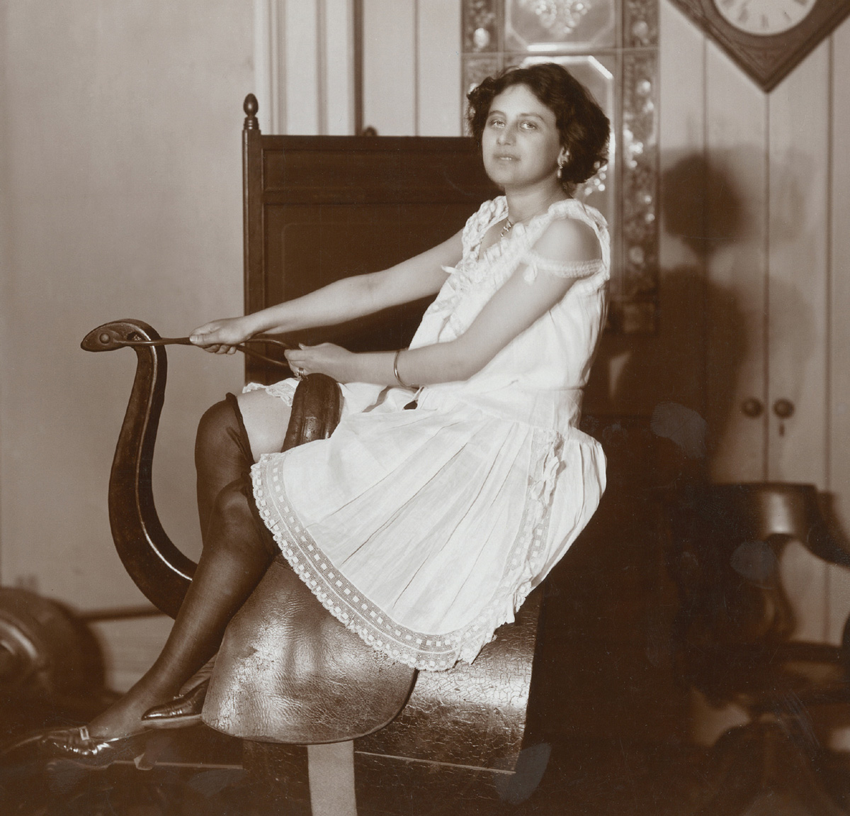 A woman poses on a horse riding simulator at the Zander Institute in New York, 1908. Courtesy Museum of the City of New York.