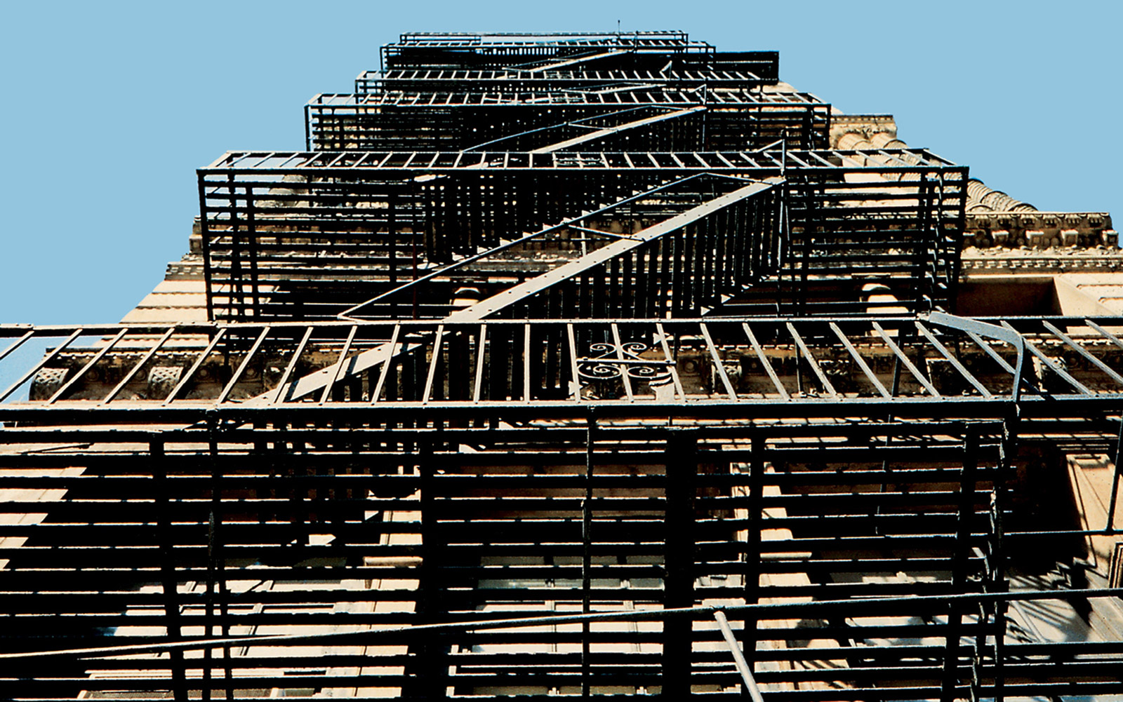 A photograph of a fire escape on a building in downtown Manhattan. 