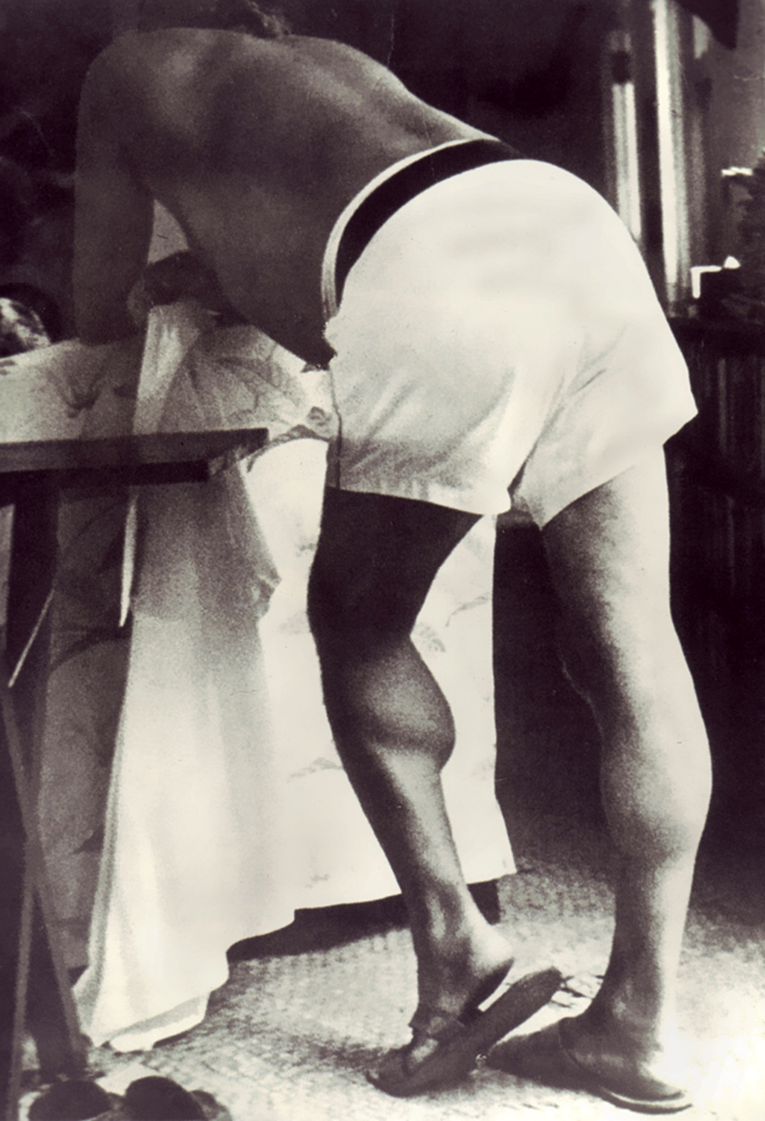 A photograph of Ernest Hemingway which shows him writing while standing up.
