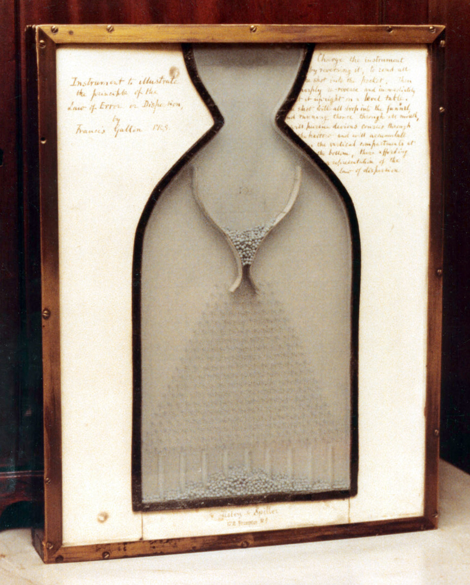 Galton Board on display at the Galton Laboratory, University College London. “Instrument to illustrate the principle of the Law of Error or Dispersion, by Francis Galton FRS.” Courtesy Stephen M. Stigler.
