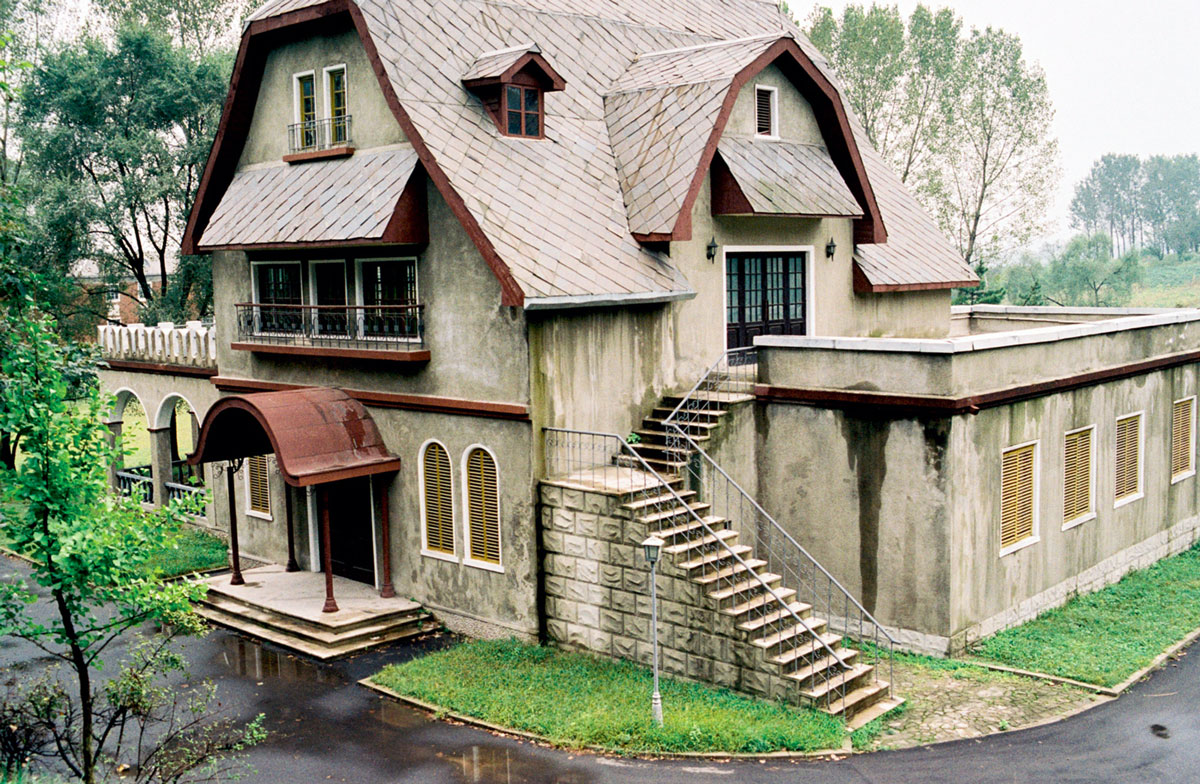 A photograph of Bavarian homes made of military-grade cement in a North Korean studio complex.