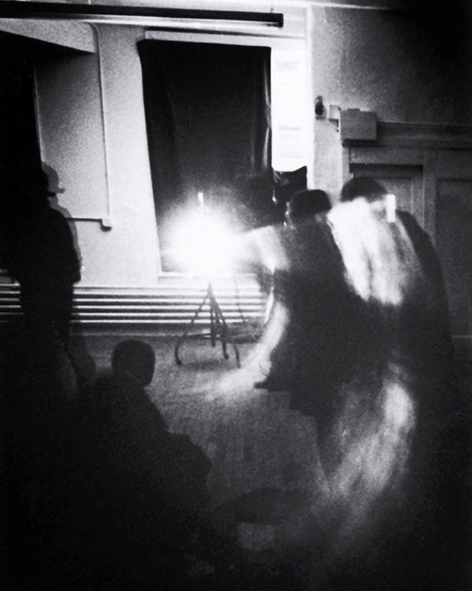 A 1974 photograph of “Line Describing a Cone” being projected at Artists Space in New York. 
