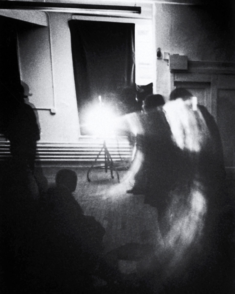 A 1974 photograph of “Line Describing a Cone” being projected at Artists Space in New York.