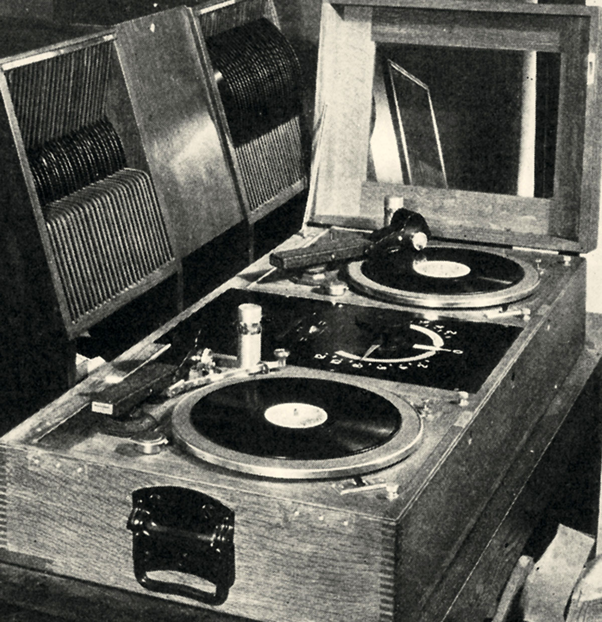 A circa 1929 photograph of a Western Electric non-sync turntable unit in a wooden desk cabinet. 