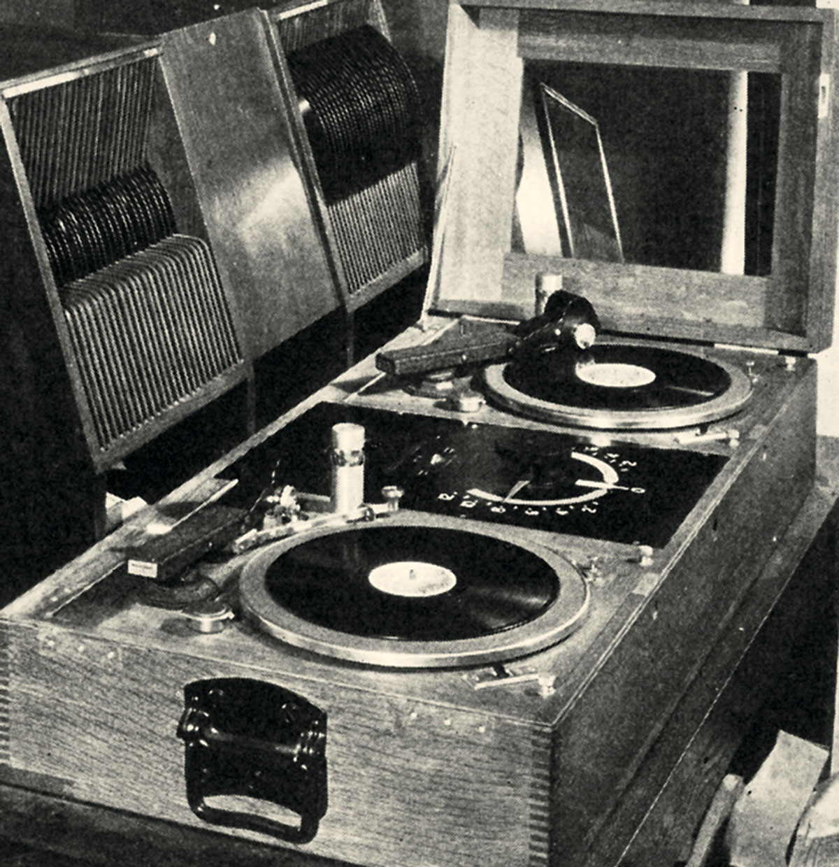 A circa 1929 photograph of a Western Electric non-sync turntable unit in a wooden desk cabinet.